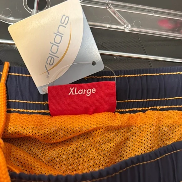 Supreme Big Letter Water Board Shorts with Bold Graphic Design